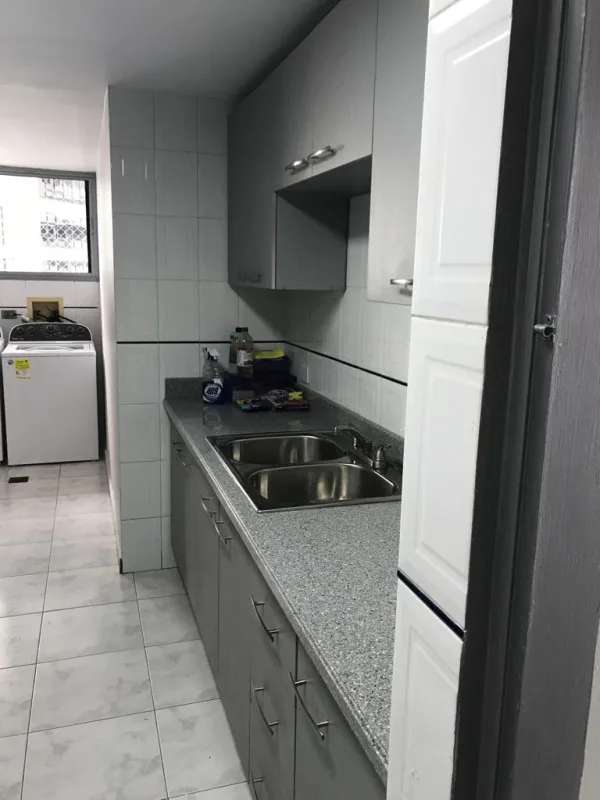 Spacious living room with balcony views city skyline Punta Paitilla Pacific Star Tower Panama City