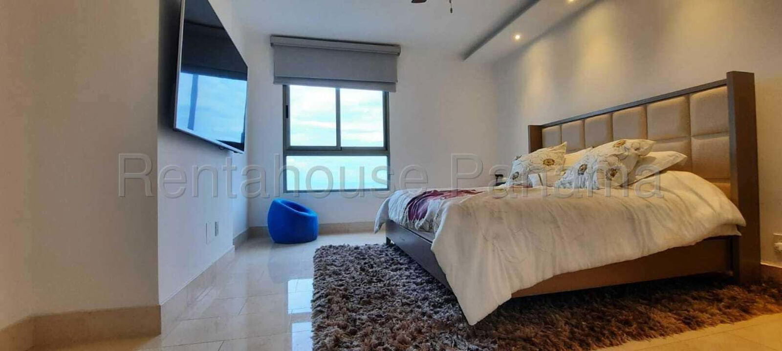 Elegant bathroom with marble finishes, glass shower, modern fixtures at Santa María Empire