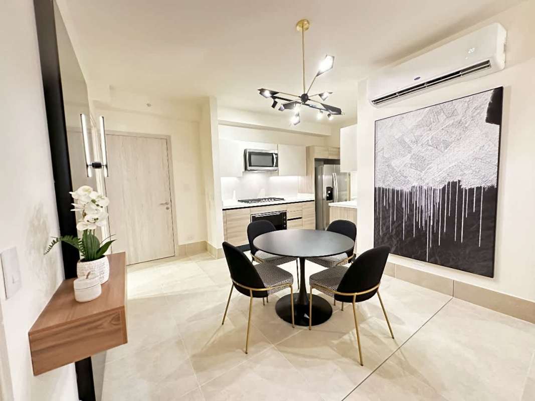 Modern bathroom with glass shower, vanity, neutral tiles in Santa Maria rental apartment