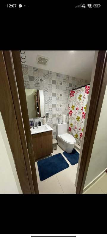 Contemporary bathroom with decorative tiles walk-in shower and vanity sink PH Worldwide Panama