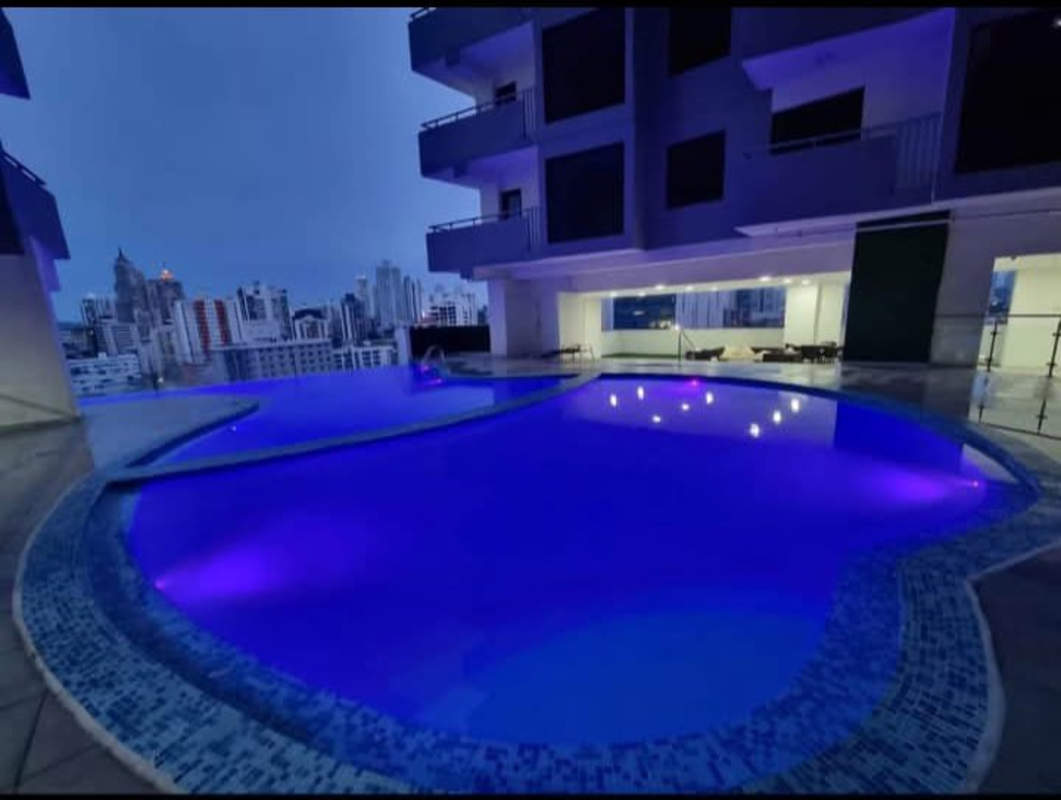 Tall modern tower with balconies and glass facade PH Worldwide on Vía España Panama City