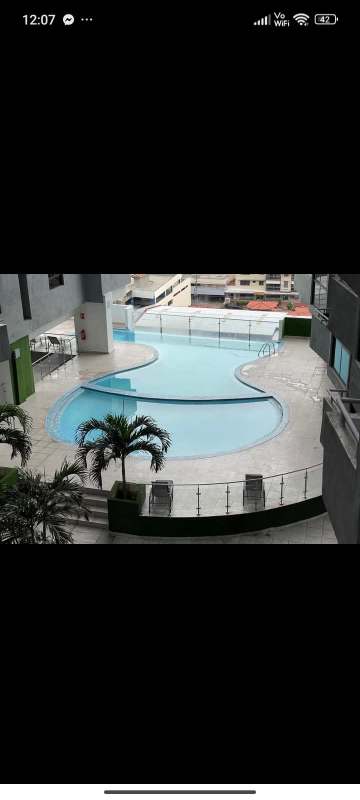 Rooftop pool with city skyline view dusk lighting PH Worldwide Panama City
