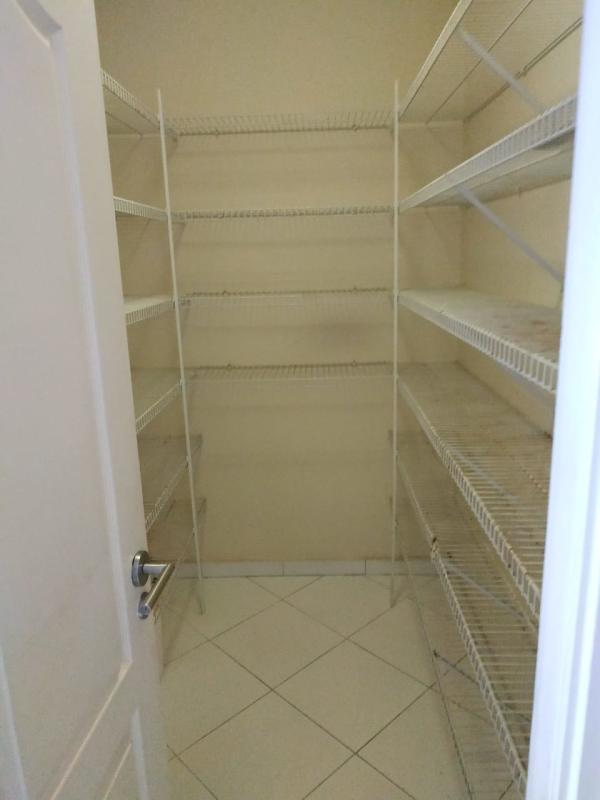 Spacious kitchen featuring granite counters, island, and large windows with sea view in PH Miramar Avenida Balboa