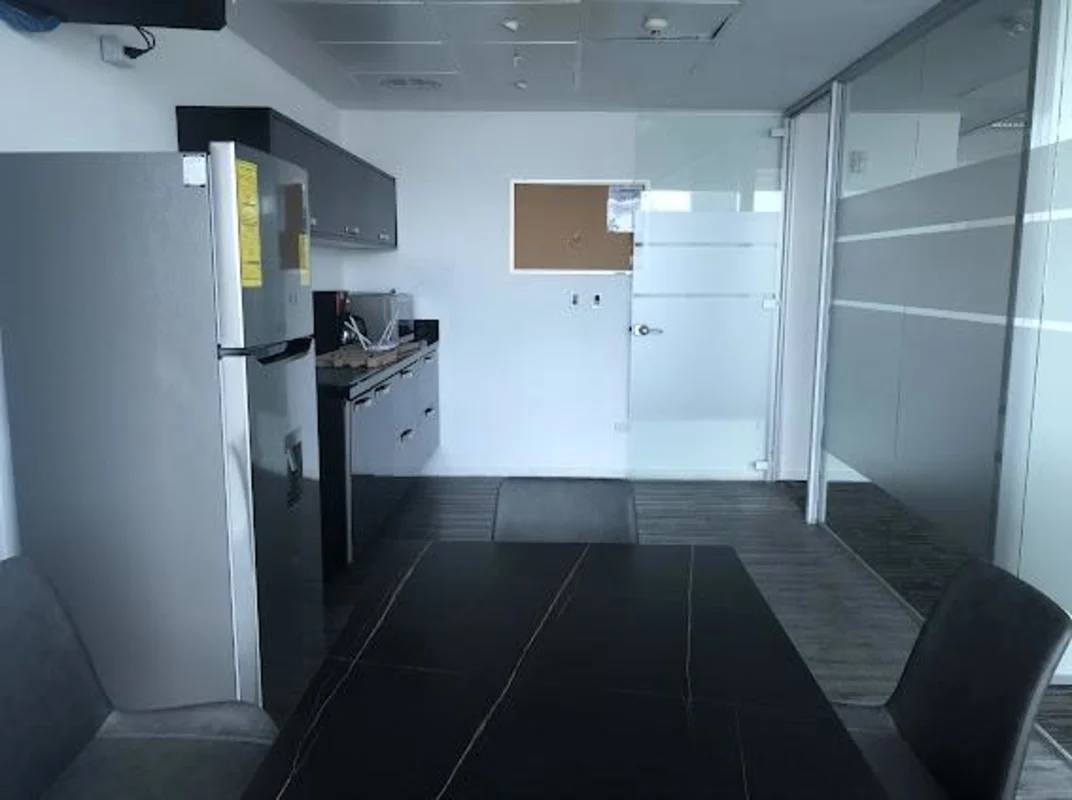 Glass-walled conference room with city skyline view in Oceania Business Plaza Panama