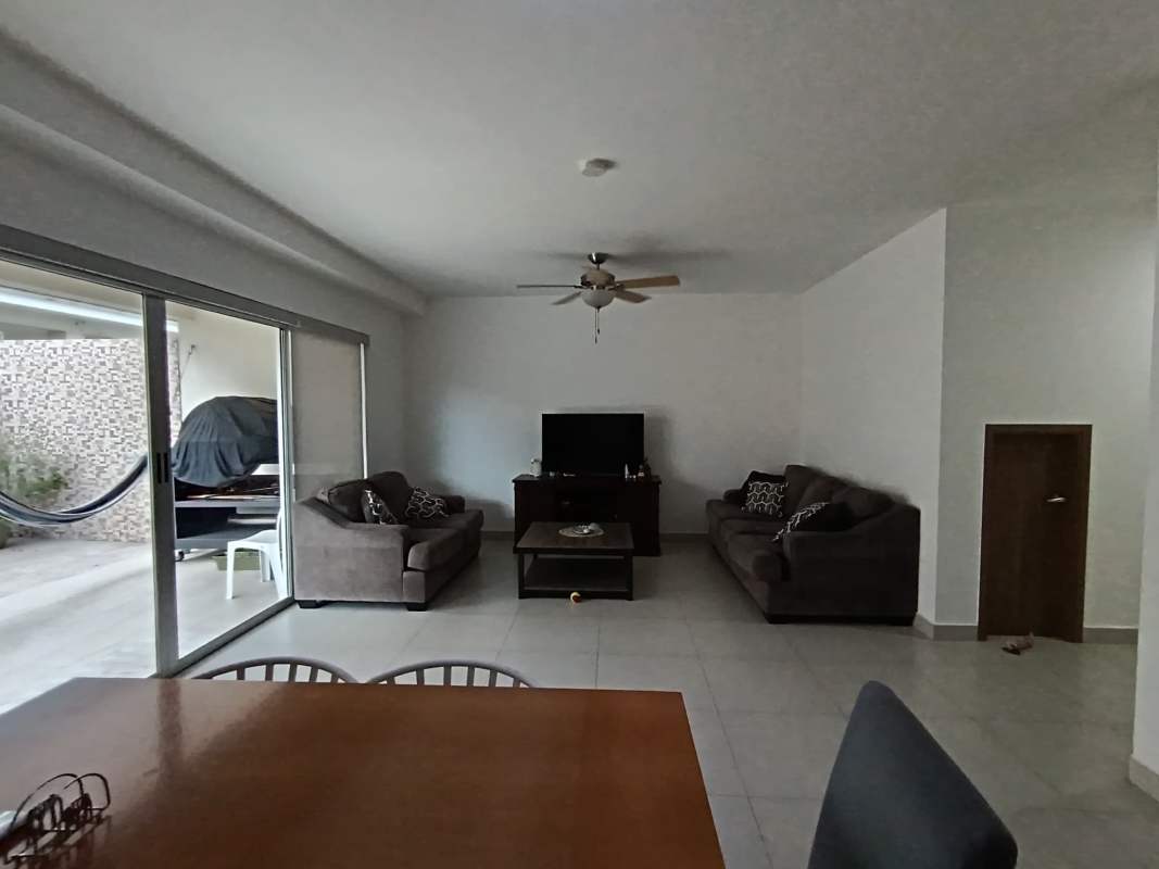 Bright master bedroom with ensuite, ceiling fan, tile floors at Altos del Parque Pedregal Panama