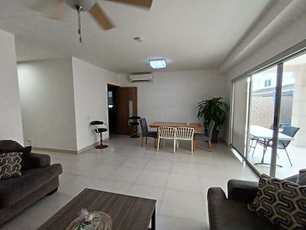 Spacious living dining room with tile floors, ceiling fans and access to backyard in Altos del Parque Panama