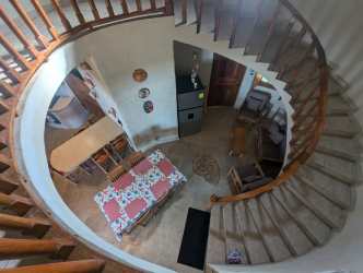 Rustic kitchen with wood cabinets and gas stove in beachfront house Palenque Panama