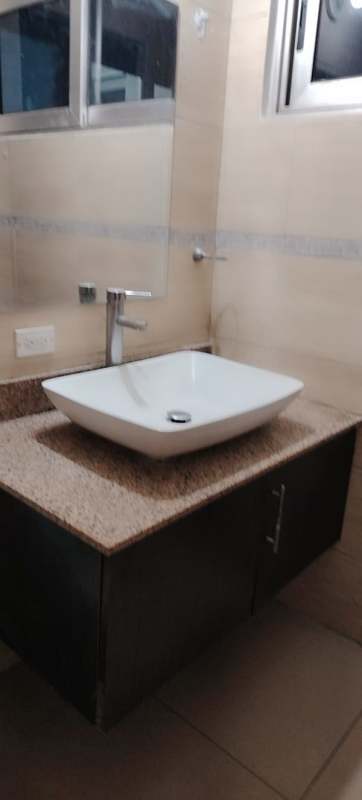 Granite counter vessel sink and mirror in PH Macedonia apartment bathroom El Ingenio Panama