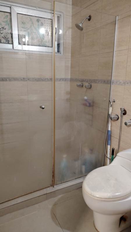 Contemporary bathroom with glass shower enclosure tile walls in PH Macedonia apartment Panama City