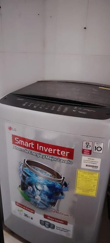 Laundry area with LG top load washing machine in PH Macedonia apartment El Ingenio Panama