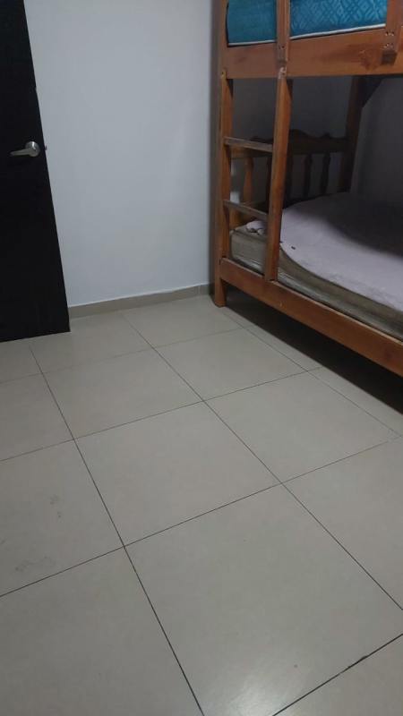 Simple tiled bedroom with wooden bunk bed in PH Macedonia rental apartment El Ingenio Panama