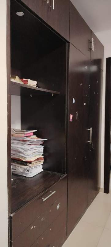 Dark wood wardrobe with shelves and drawers PH Macedonia apartment El Ingenio Panama City