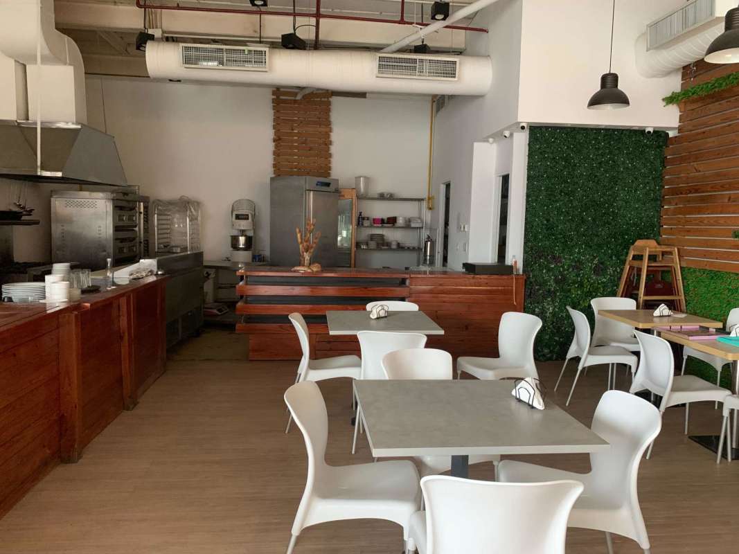 Restroom with artistic mural and utility sink in commercial space Avenida Balboa Panama