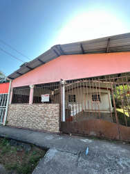 Side walkway with greenery and boundary fence Urbanización Juan Pablo II La Chorrera Panama