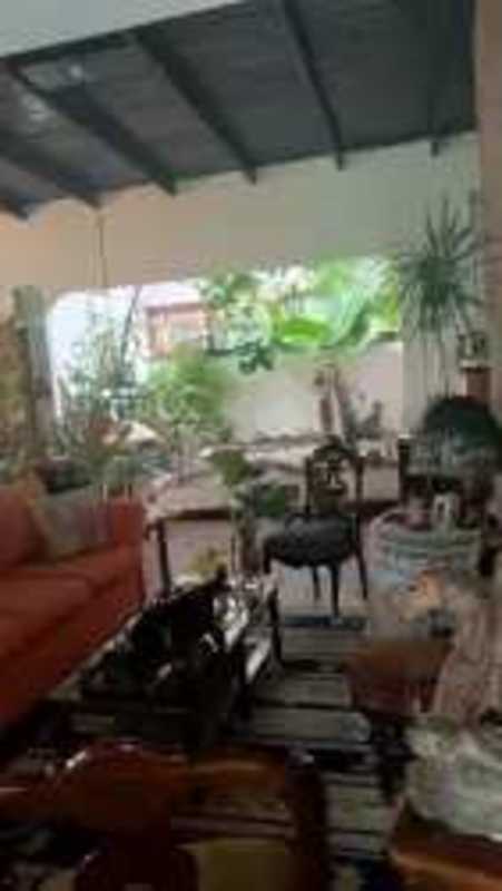 Exterior facade one-level home with mature trees concrete driveway in Betania Panama City