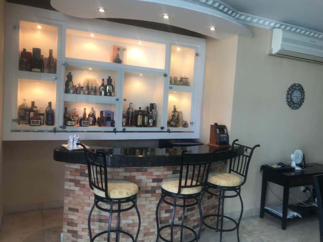 Modern dining room with large glass doors ocean view at Sky Tower Panama