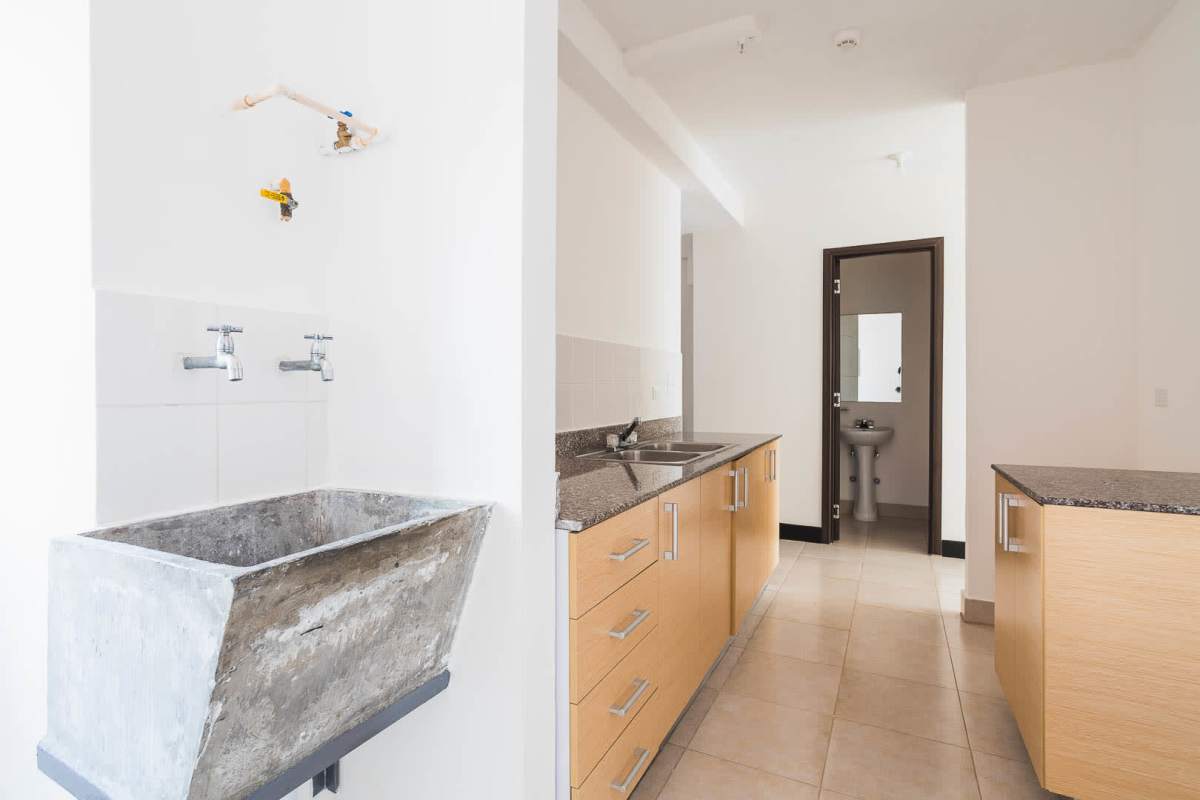 Integrated kitchen-laundry space with granite counters PH Sorrento Parque Lefevre Panama