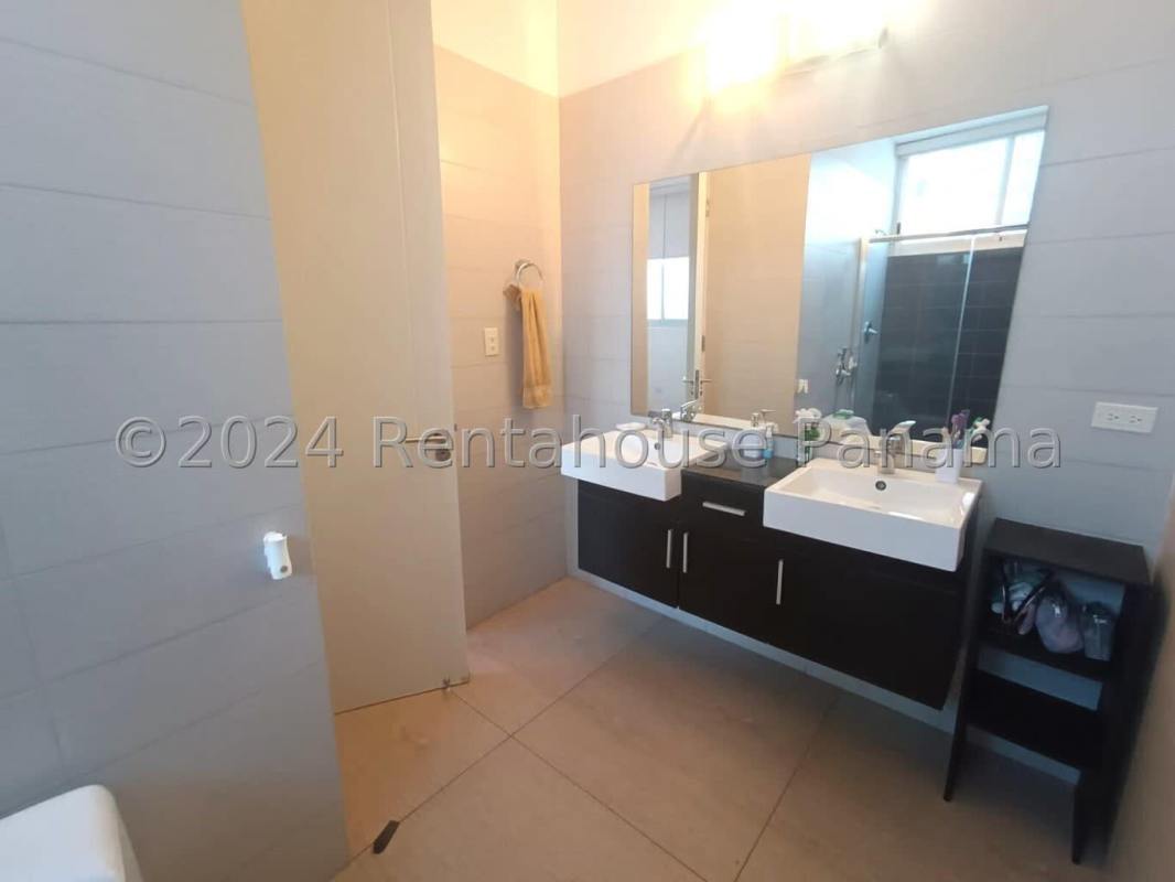 Dining room with city views through large windows at PH Bellavista Tower Panama City