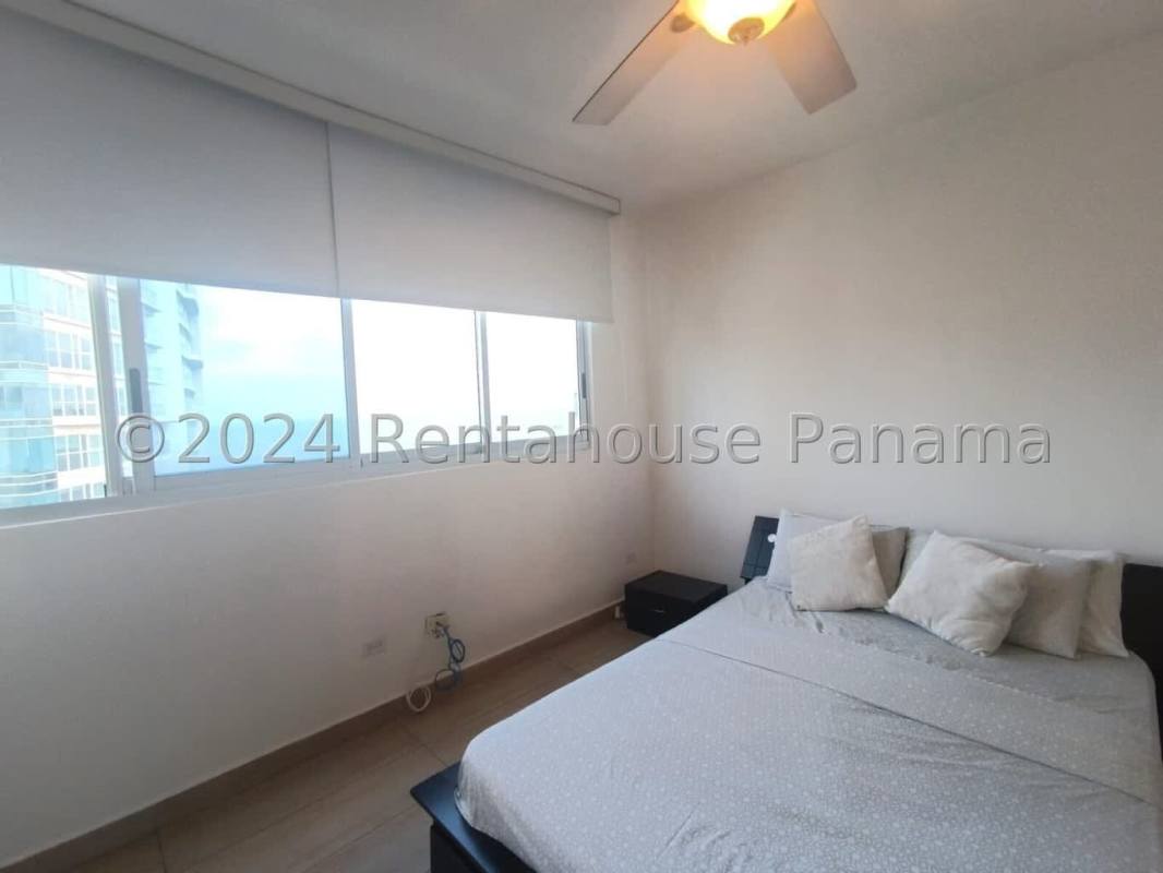Master bedroom with sea view, king bed, AC, modern decor at PH Bellavista Tower in Panama City