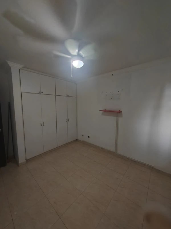 Kitchen with L-shaped counter, double sink, dark cabinets in Cerro Viento house for rent