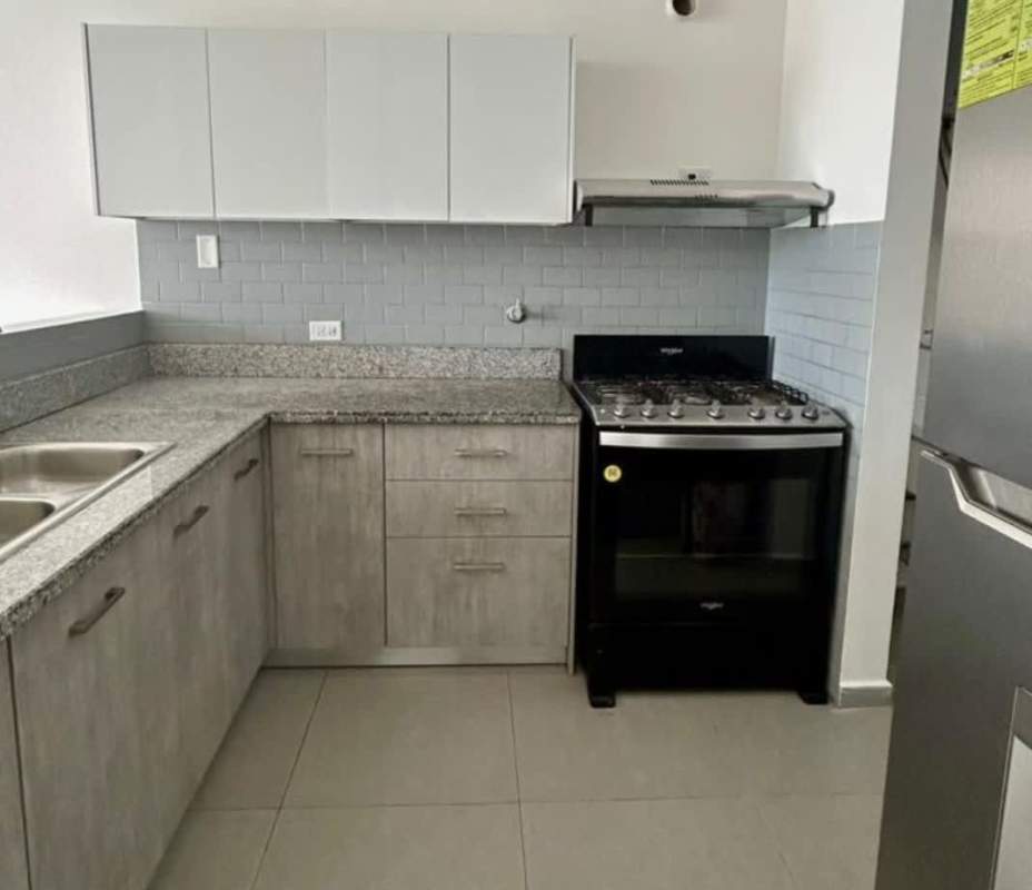 Kitchen with granite countertops, subway tile backsplash and gas stove in PH Signature Point Panama