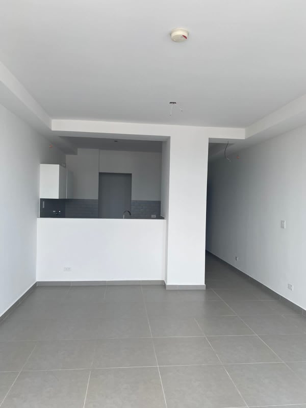 Bright living room with sliding glass doors to private balcony PH Signature Point Panama City