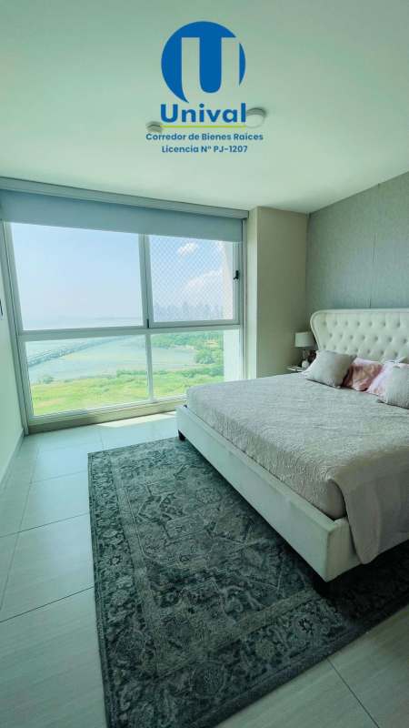 Bedroom with large window and built-in closet in oceanfront condo PH Asia Costa del Mar Panama