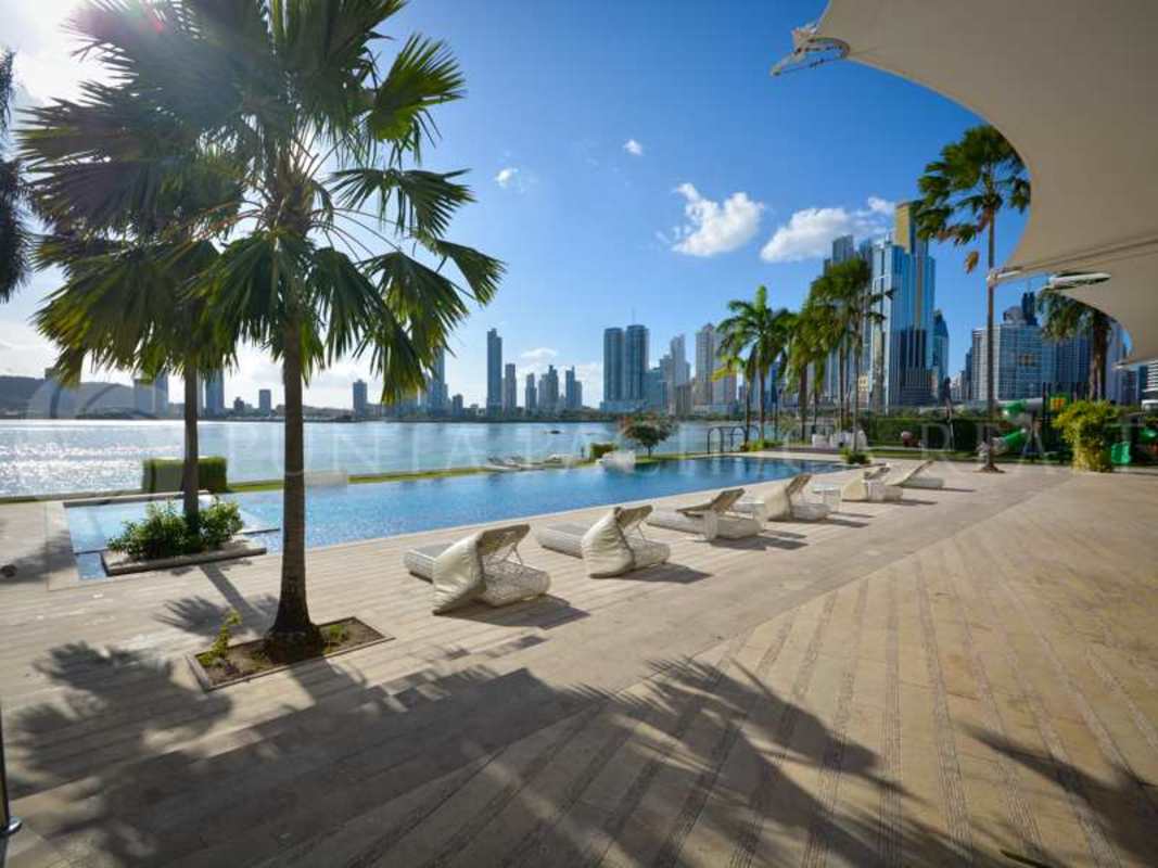 Luxury oceanfront infinity pool with city skyline backdrop at The Point Tower Panama