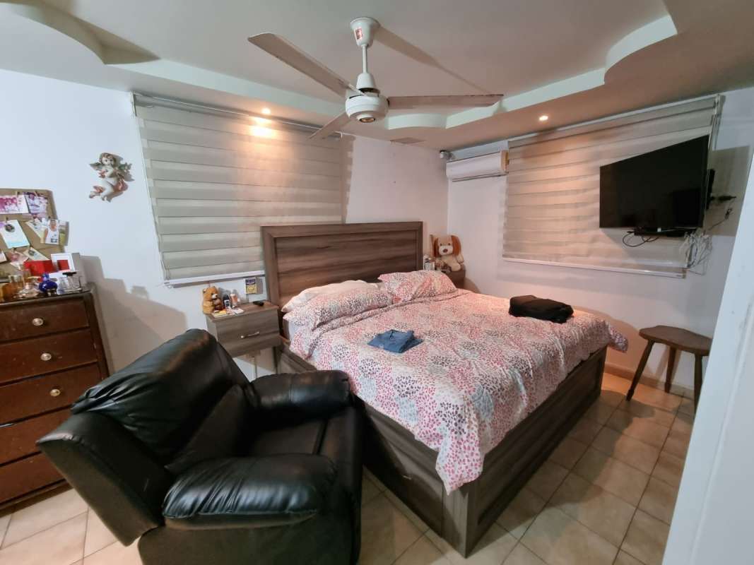 Spacious master bedroom with ceiling fan and AC Don Bosco San Miguelito