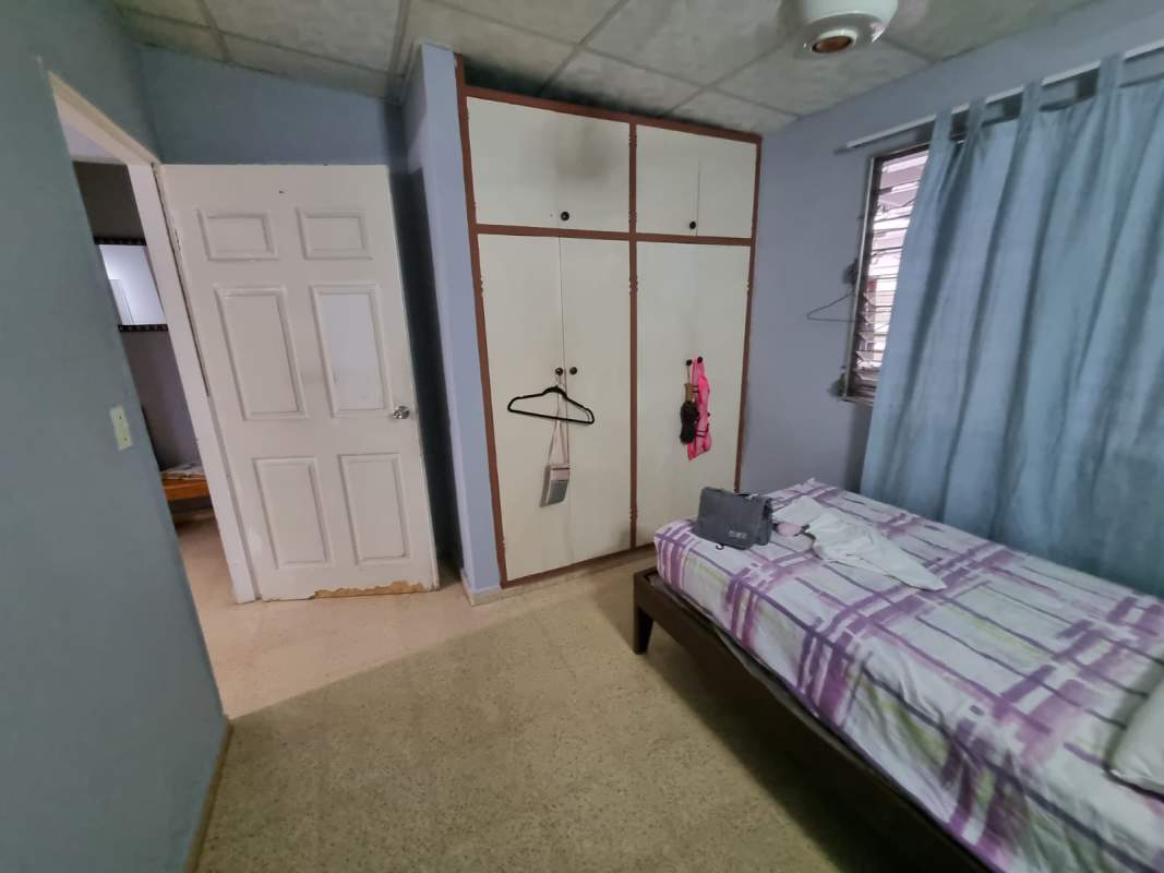 Bathroom with green glass enclosure, pedestal sink at Don Bosco Panama