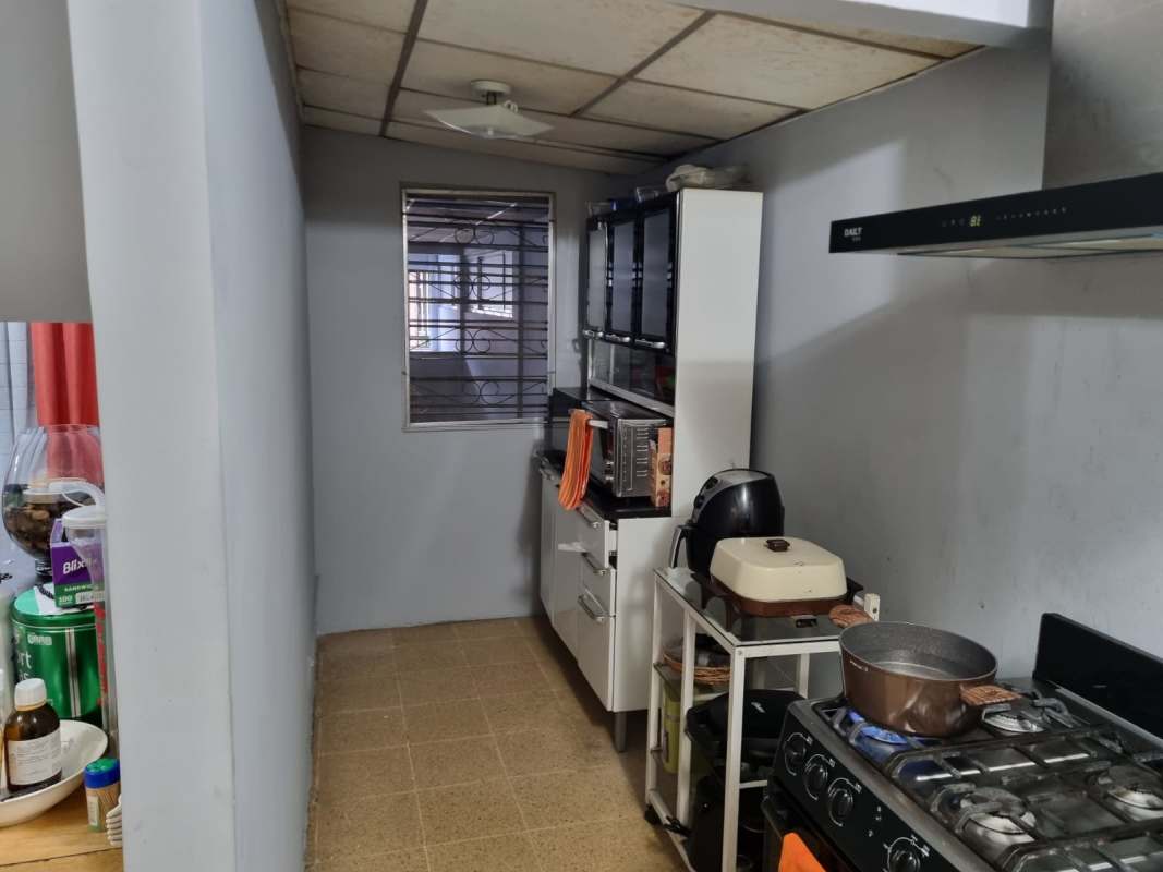 Exterior with metal gate and carport parking at Don Bosco house Panama