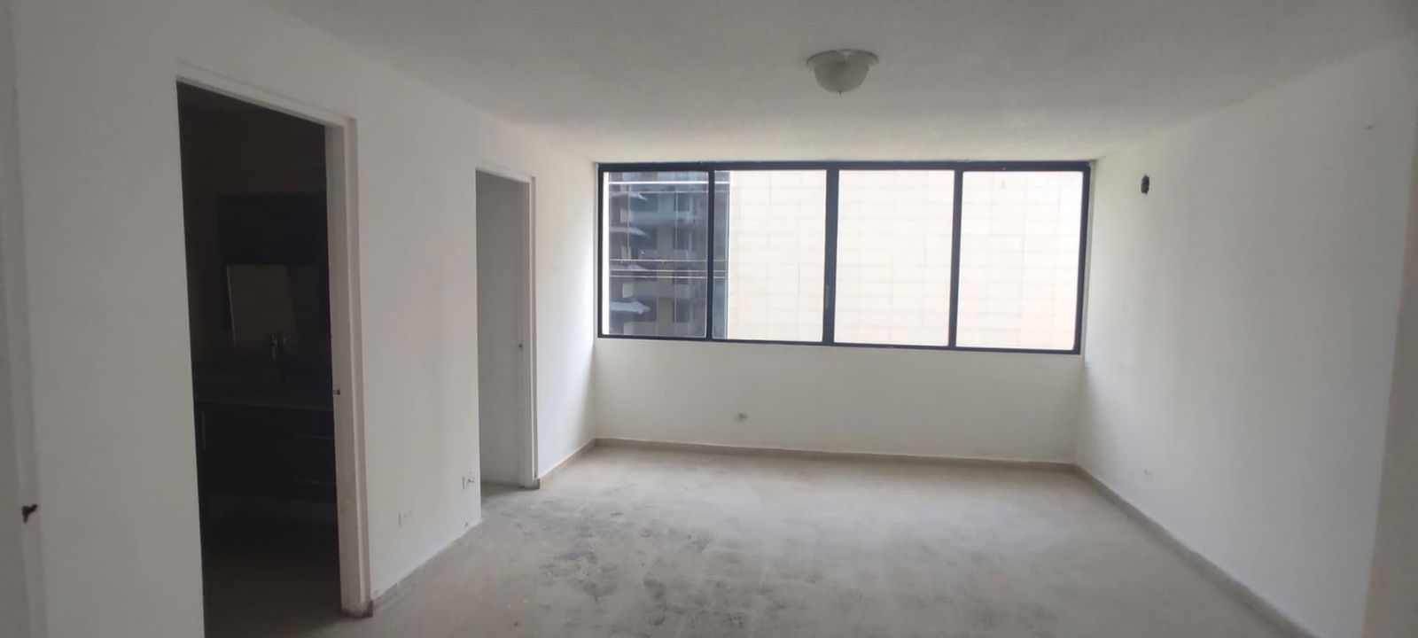 Bright kitchen area with granite counters window and cabinets Panama PH Monaco