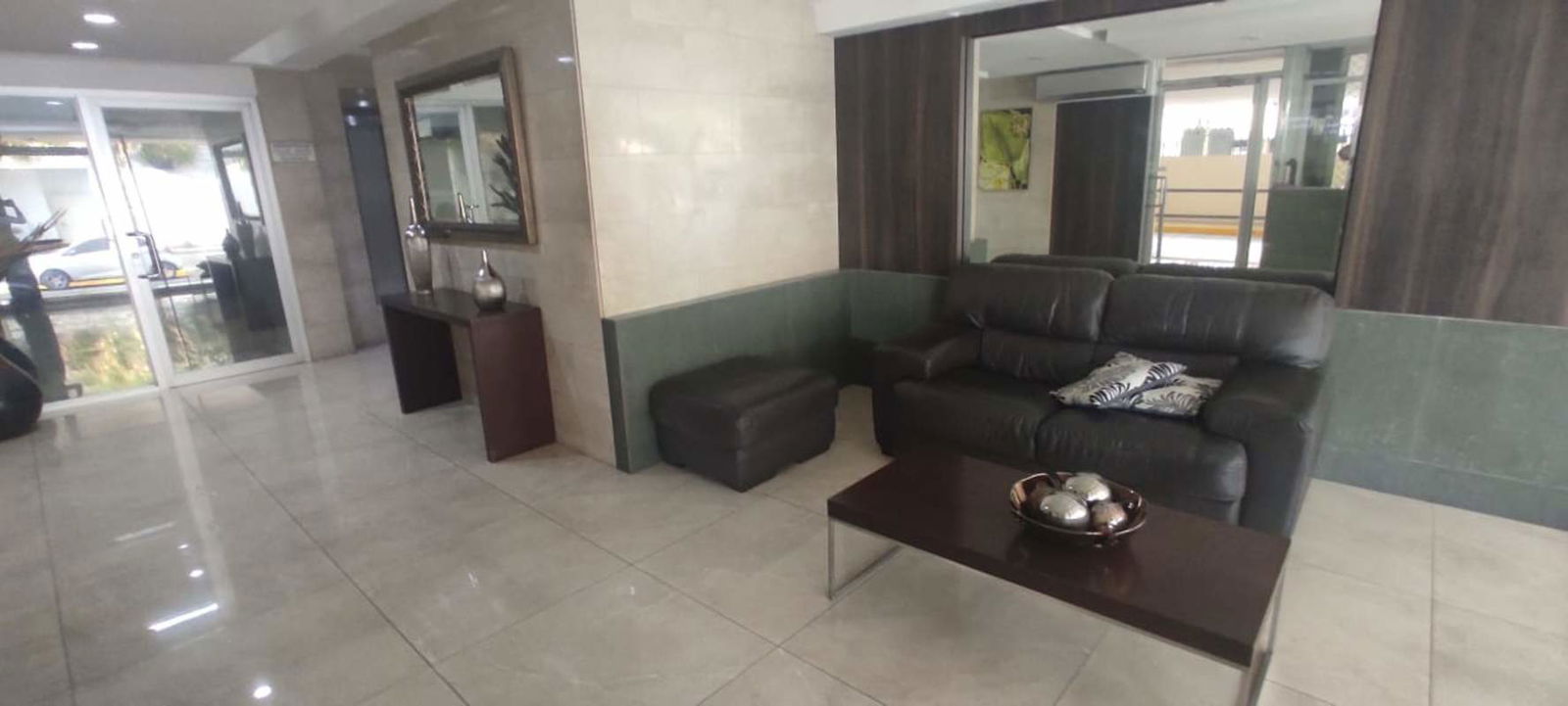 Spacious empty living room with large windows and ceramic floors at PH Monaco Obarrio Panama