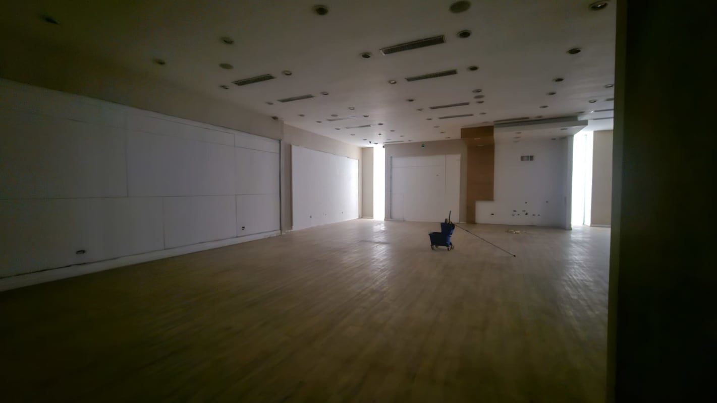 Empty interior retail space with wooden floors in Albrook Mall Panama City for sale