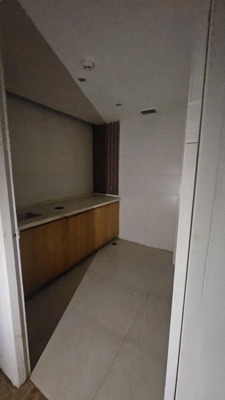 Empty retail store space for sale at Albrook Mall with gypsum walls and laminate floors