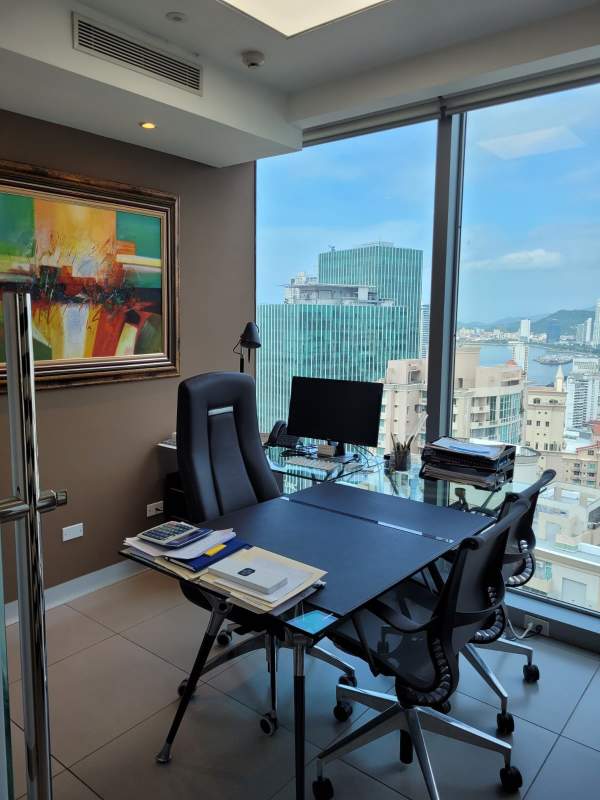 Modern private office with glass walls and skyline view in Punta Pacifica Panama City