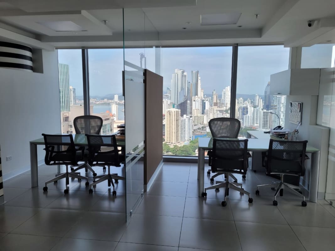 Compact kitchenette with granite counter, microwave and fridge in Punta Pacifica office Panama City