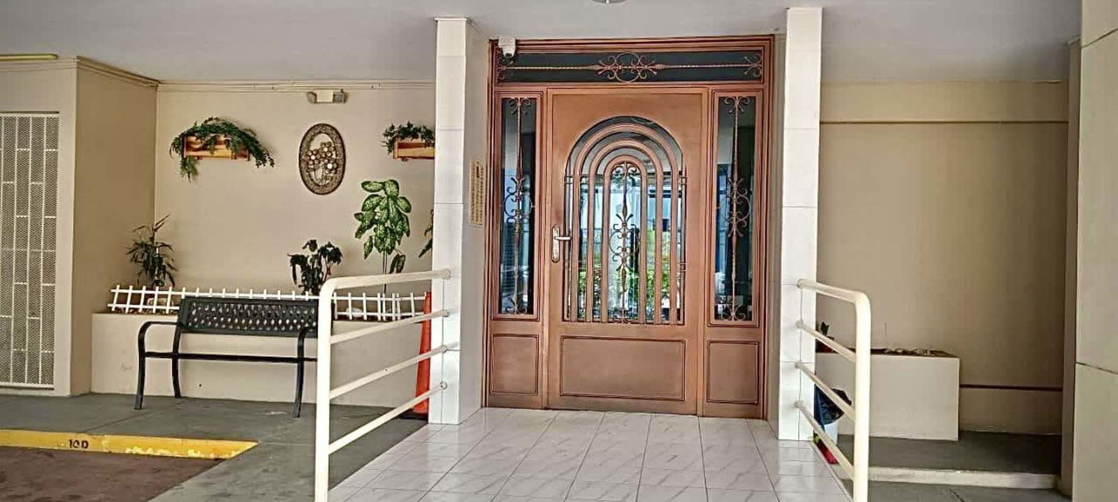 Compact bathroom with modern shower and colorful accent tiles in Villa de las Fuentes Tower apartment Panama