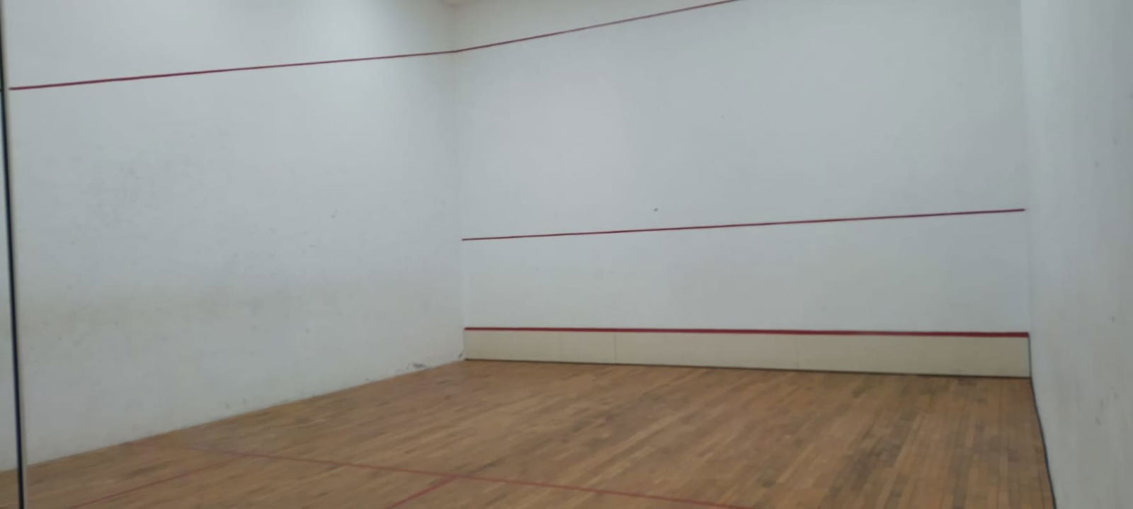 Squash court with wooden floor glass wall inside PH Costa Pacifica Punta Pacifica