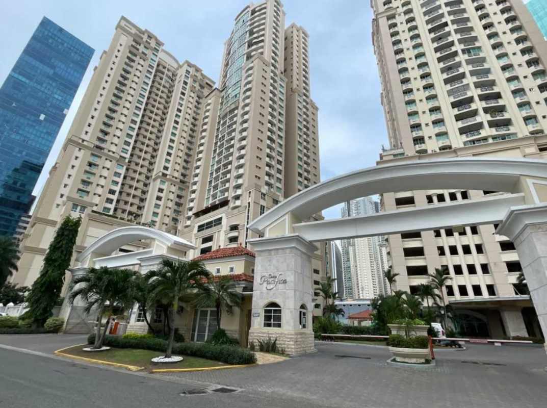Outdoor pool with gazebo, lounge chairs, and palm trees at PH Costa Pacifica in Punta Pacifica Panama
