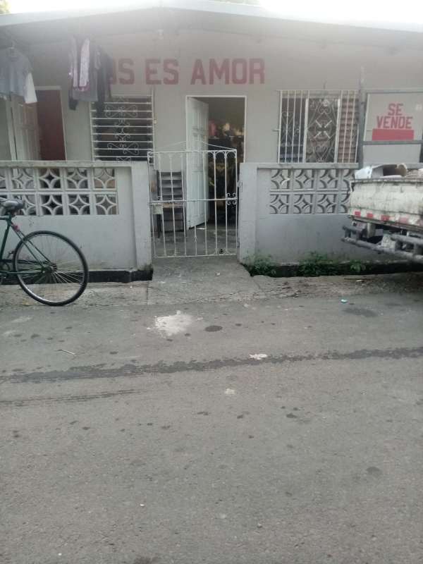 Front gated porch area of commercial investment house Puente del Rey Panama City