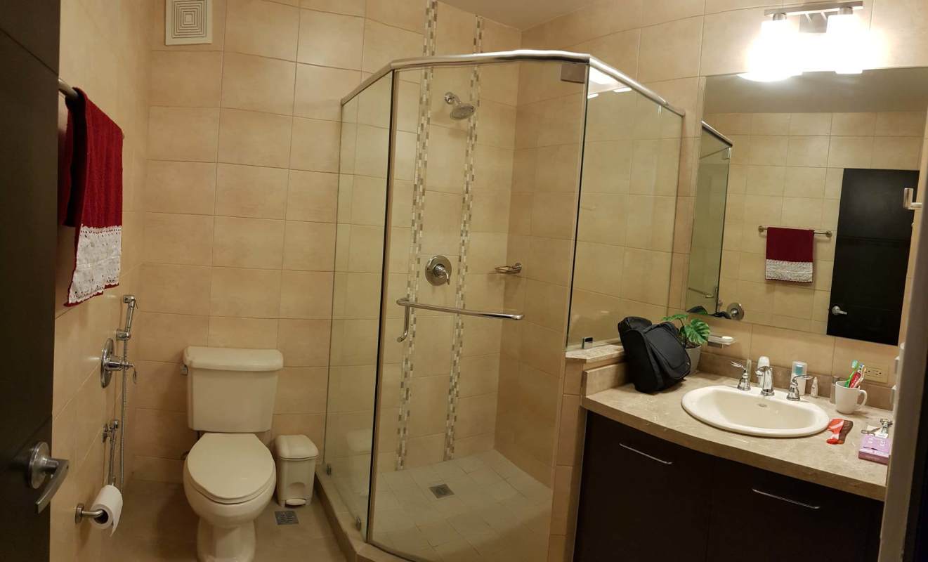 Contemporary bathroom with glass shower, sink vanity and beige tiles Embassy Village Clayton