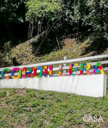 Colorful Cordillera entrance sign surrounded by greenery in Chiriquí Panama