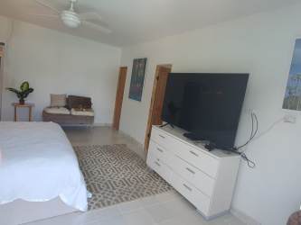 Bedroom with TV dresser and ceiling fan Coronado Panama house for sale