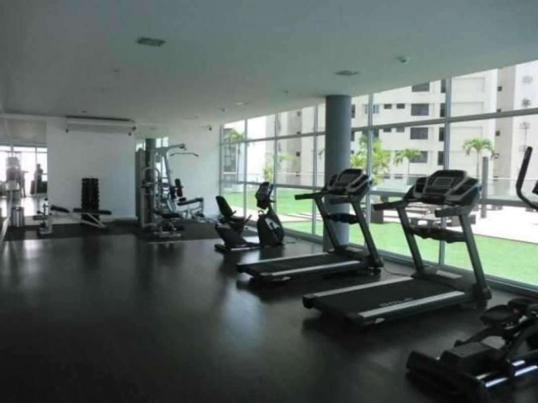 Rooftop infinity swimming pool with lounge chairs and panoramic skyline in Panama City