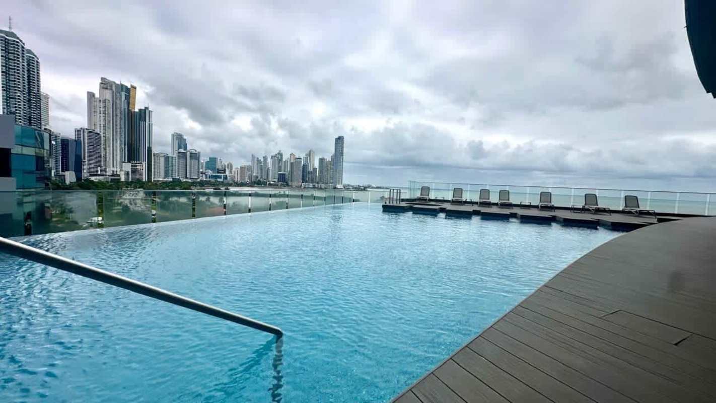 Rooftop lounge terrace with panoramic Pacific bay view and city skyline at Yacht Club Tower Panama