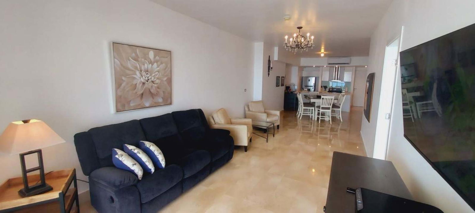 Modern bathroom with marble walls and vessel sink in PH YOO Panama apartment