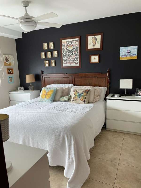 Kitchen with island, stainless steel appliances, gray cabinets, subway tile backsplash in San Francisco condo