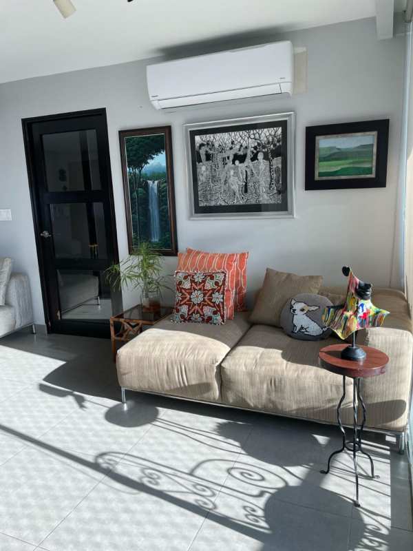 Bathroom with white textured tiles, vanity sink, shower and mirror in Coco del Mar Tower