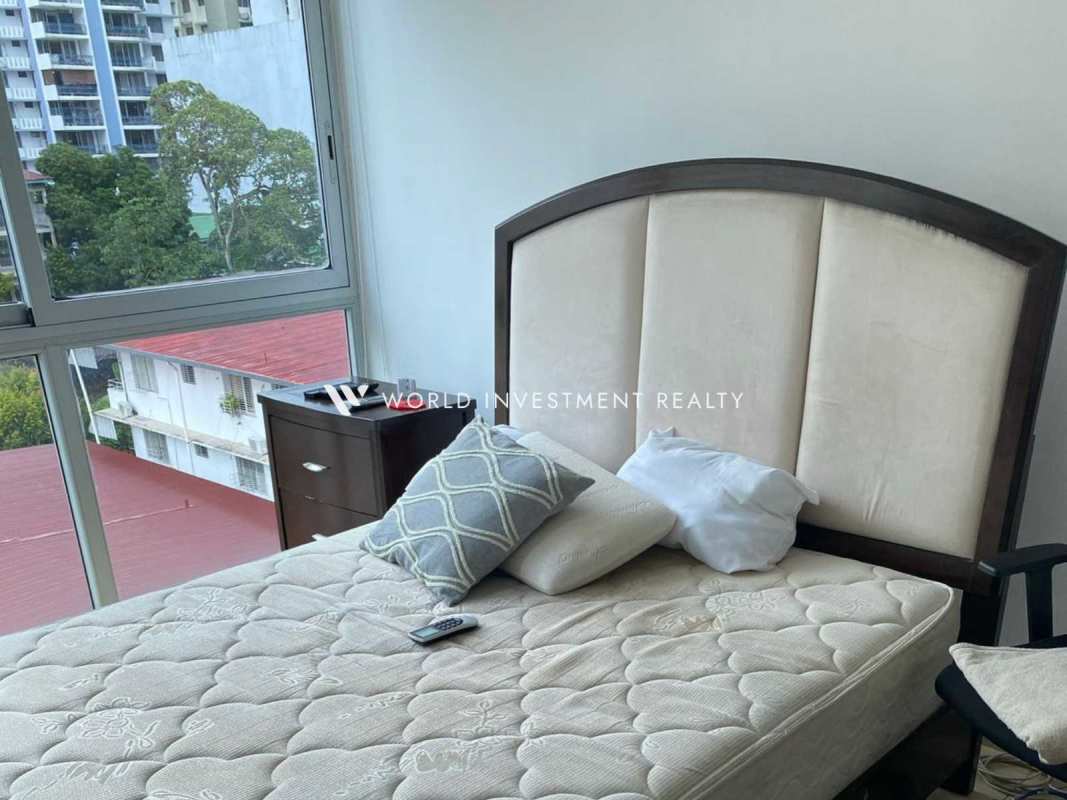 Bright bedroom with natural light and skyline view in PH Park City rental apartment